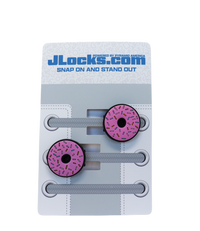 Pink donut-shaped shoe lace locks on a JLocks.com branded card with gray shoelaces.